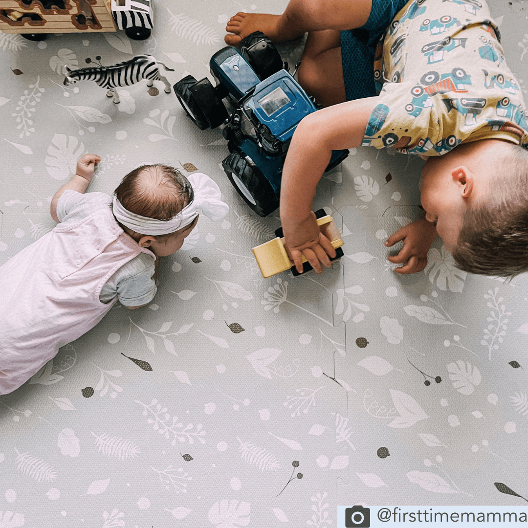 children playing on the padded foam Metallic Garden playmat from Maxi and Moo