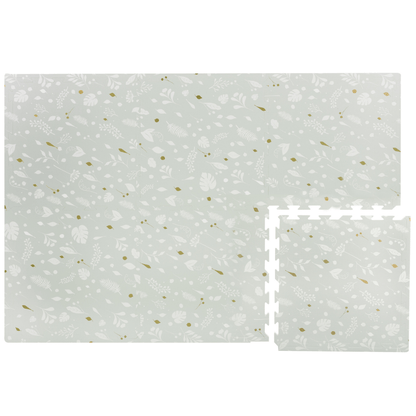 Image of a Metallic Garden Play Mat showcasing its modular design, with one tile disconnected from the full mat. The play mat features a charming design of white leaves on a stylish grey background with pops of metallic gold. This mat will bring a touch of elegance and playfulness to your child's play area or nursery.